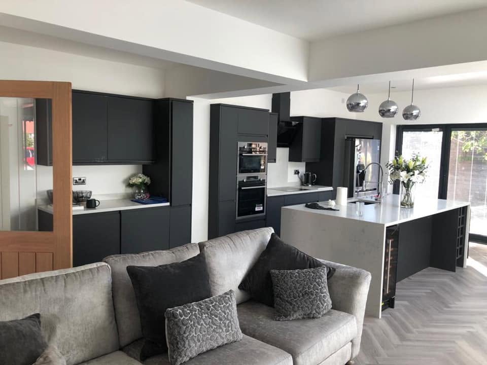 Grey gloss kitchen with island and herringbone floor — full kitchen install by RG