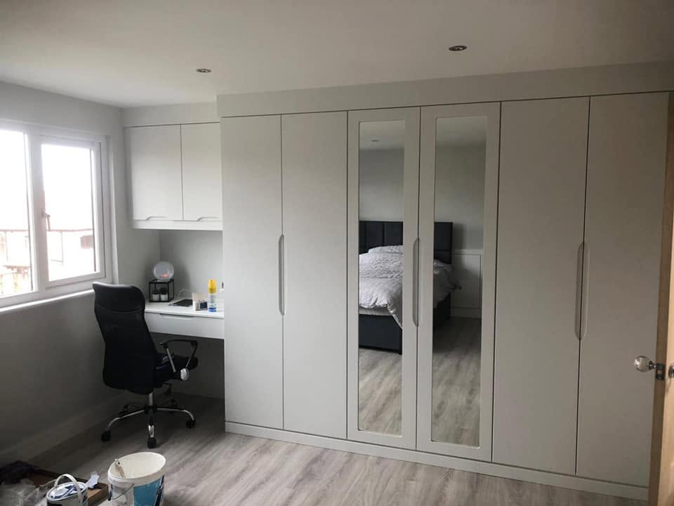 Bespoke fitted wardrobes in a master bedroom — joinery by RG