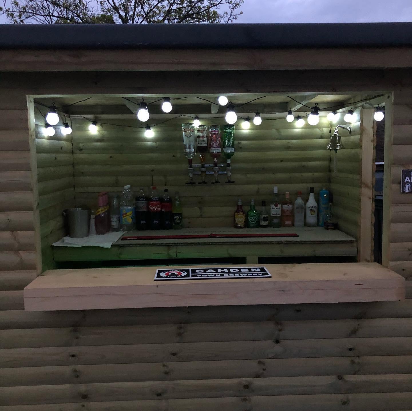 Bespoke garden bar built from timber with composite decking — RG landscaping