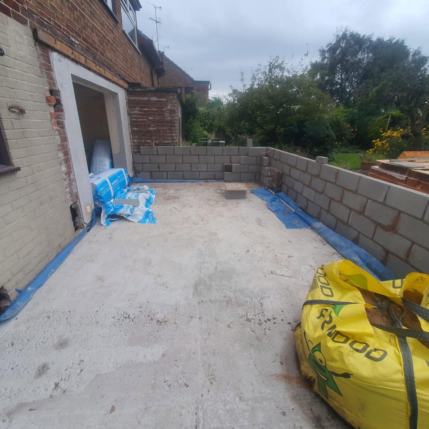 Rear garden prepared for landscaping with new blockwork retaining walls and levelled base — RG landscaping
