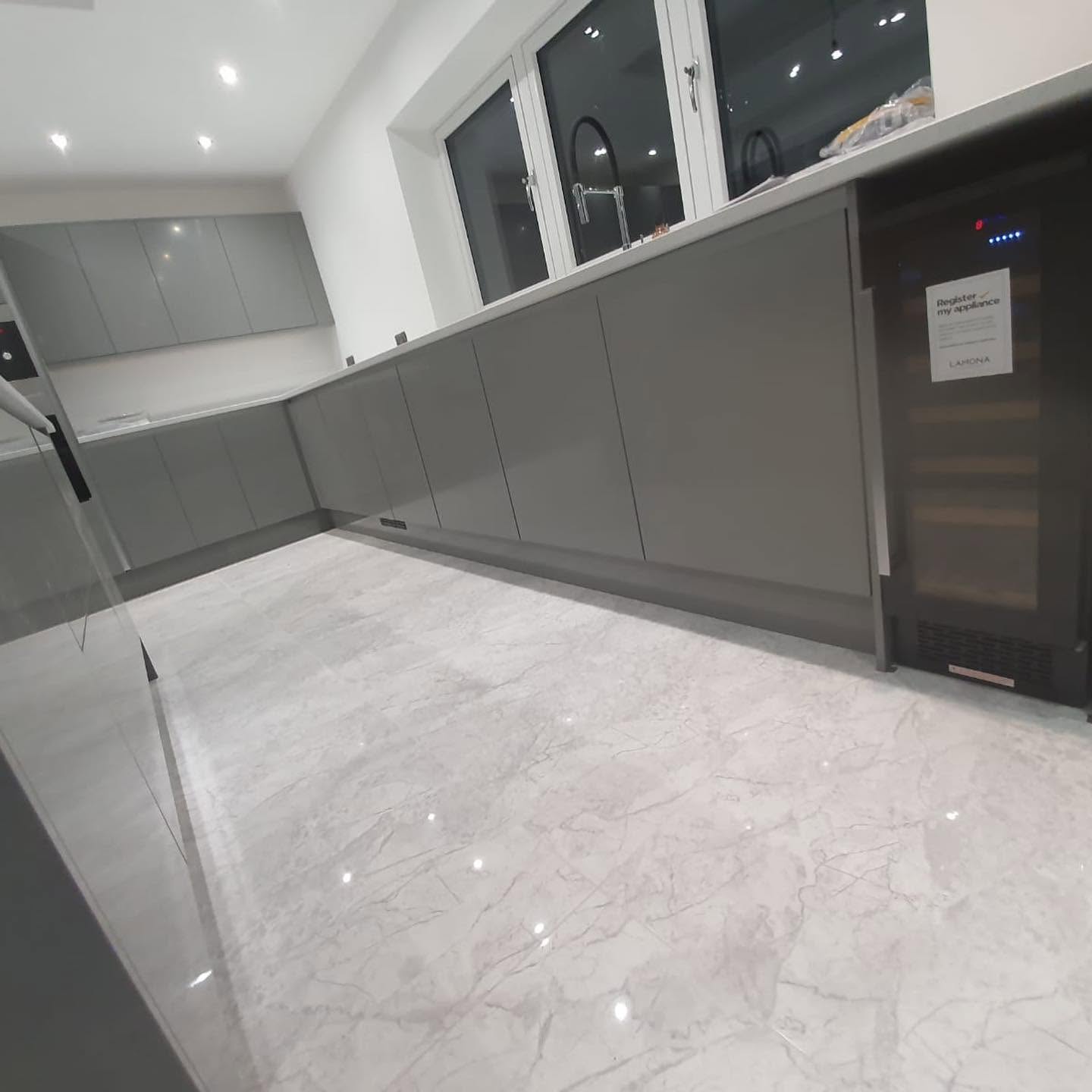 Grey kitchen units and quartz worktops — full install by RG