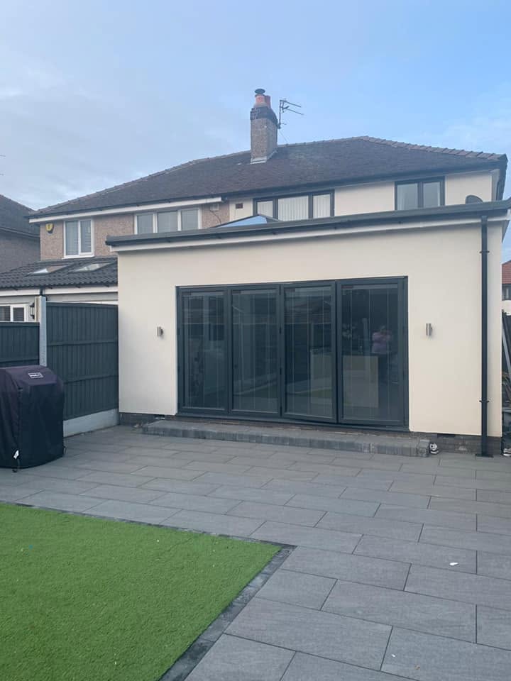 Single-storey rear extension with bi-fold doors and new patio — RG Northwest